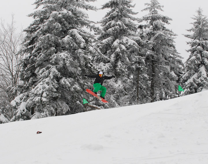 man jumping on snowboard