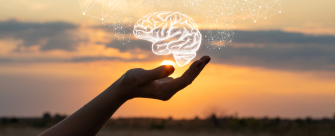 Hand shows the brain in the sun and sky.