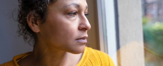 Black woman feeling negative emotions alone at home