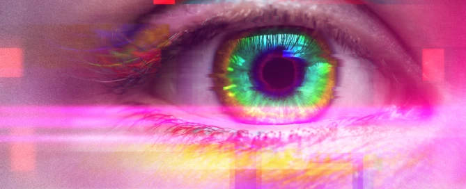 Female eye with colorful iris. Effect of using psychoactive drug and having psychedelic trip with hallucinations. Glitch and noise effects applied.